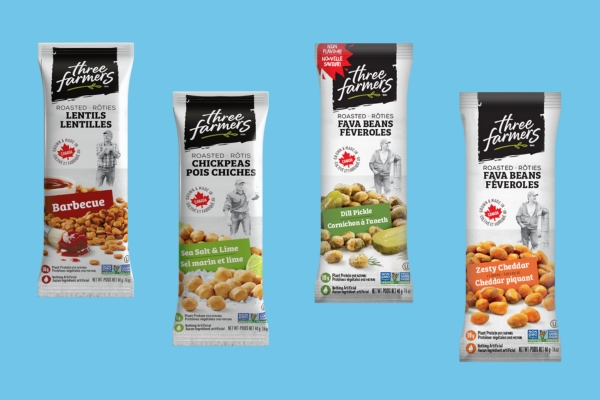 Three Farmers snacks packages on sky blue background